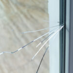 Crack,On,The,Glass,At,A,Residential,House.,Plastic,Window
