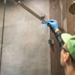 Workers,Are,Installing,Glass,Door,Of,The,Shower,Enclosure.