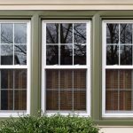 Three,New,Replacement,Windows,With,Green,Trim,On,Front,Of